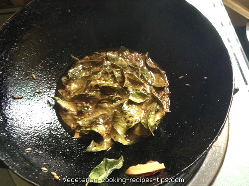 tempering thin poha chivda 500x373